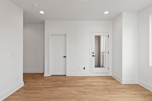 spare room with light hardwood / wood-style floors