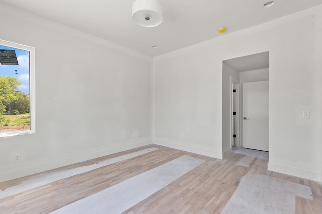 unfurnished room featuring light wood-type flooring