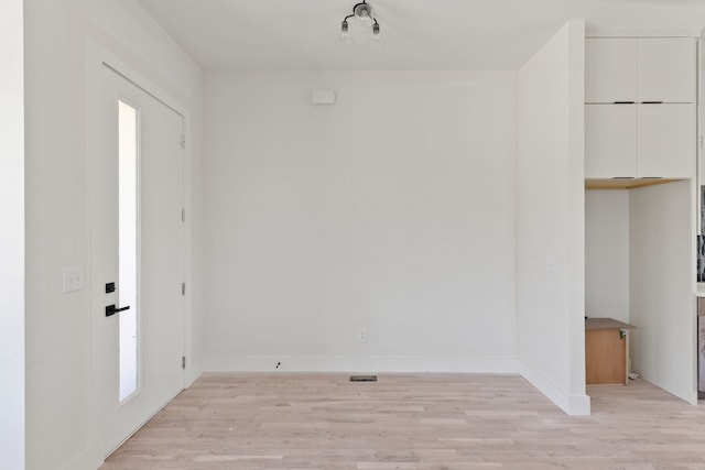 foyer entrance with light hardwood / wood-style flooring