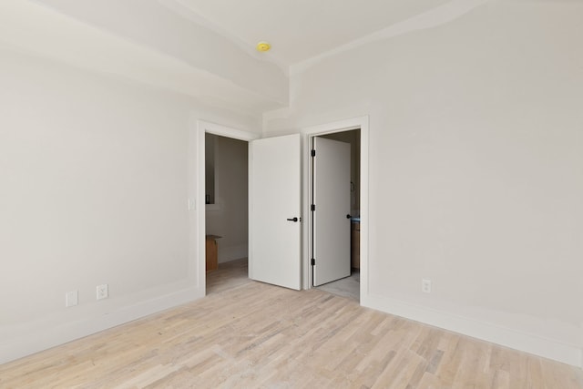 empty room with light hardwood / wood-style floors