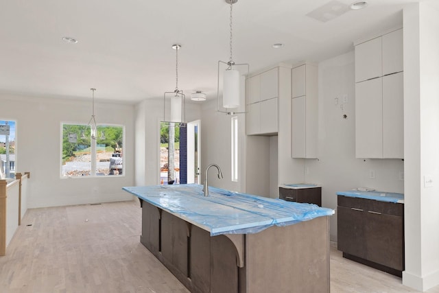 1016 W Trinity Ln Unit 7, Nashville, TN 37218 - kitchen with healthy amount of natural light, modern cabinets, white cabinetry, and recessed lighting