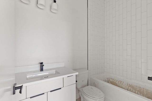 bathroom featuring toilet and vanity