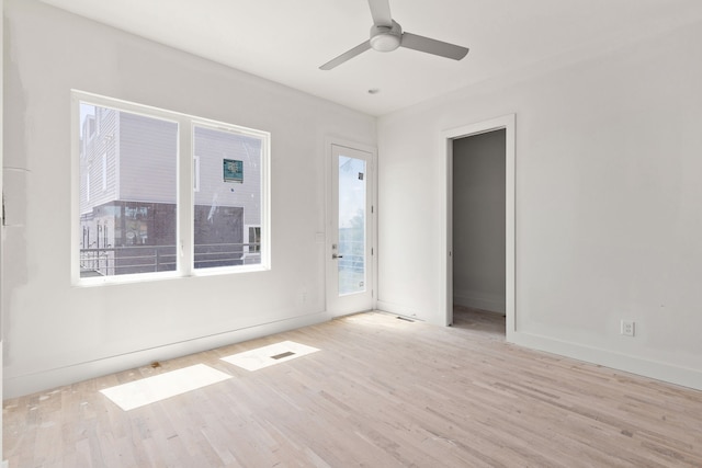 unfurnished room with ceiling fan and light hardwood / wood-style flooring