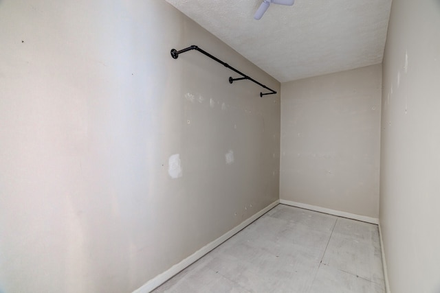 unfurnished room featuring a textured ceiling