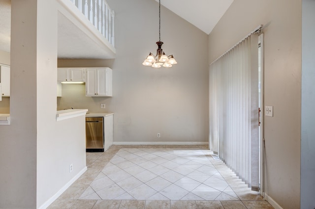 kitchen with white cabinetry, light tile patterned floors, a notable chandelier, hanging light fixtures, and dishwasher