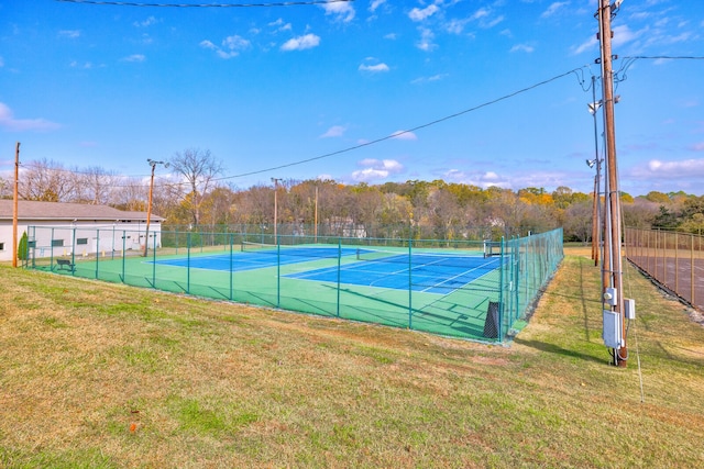 view of sport court featuring a yard