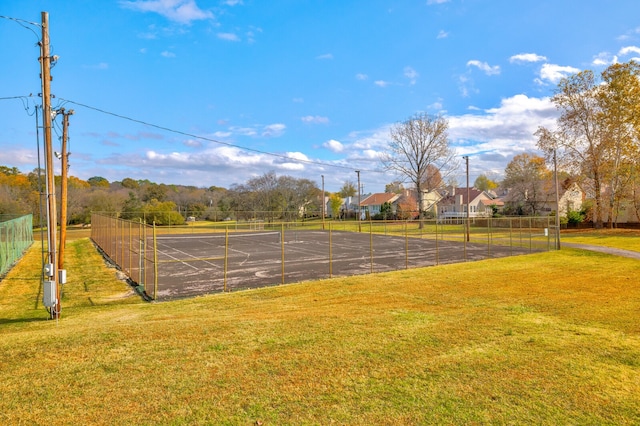 view of property's community with a lawn