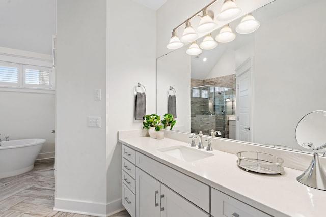 bathroom with vanity, shower with separate bathtub, and lofted ceiling