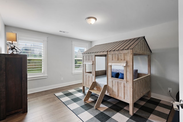 bedroom featuring dark hardwood / wood-style floors