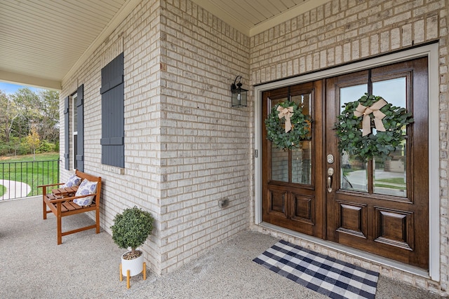 doorway to property with covered porch