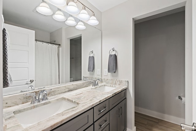 bathroom with vanity and hardwood / wood-style floors