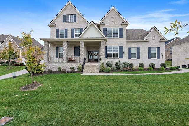 craftsman inspired home featuring a porch and a front yard