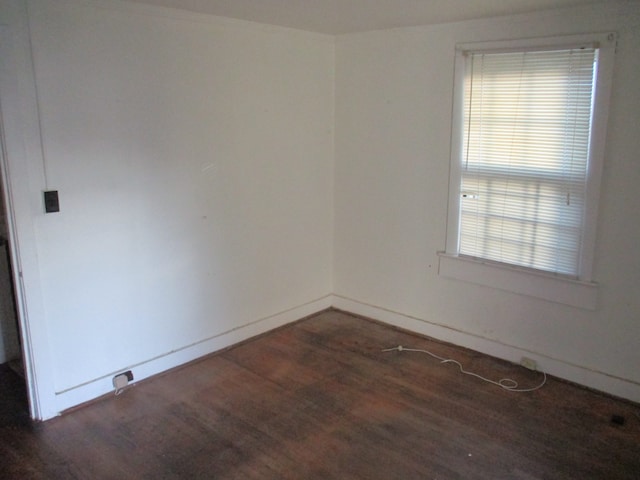 empty room featuring dark hardwood / wood-style flooring