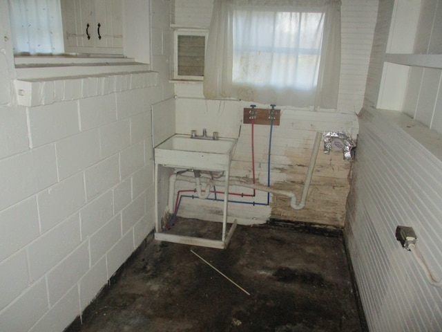 interior space with concrete flooring and sink