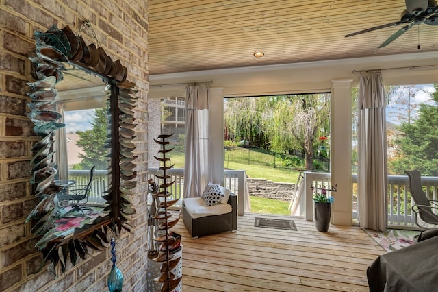 entryway featuring hardwood / wood-style flooring, a healthy amount of sunlight, and ceiling fan