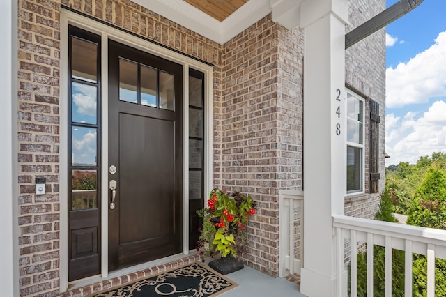 property entrance featuring covered porch