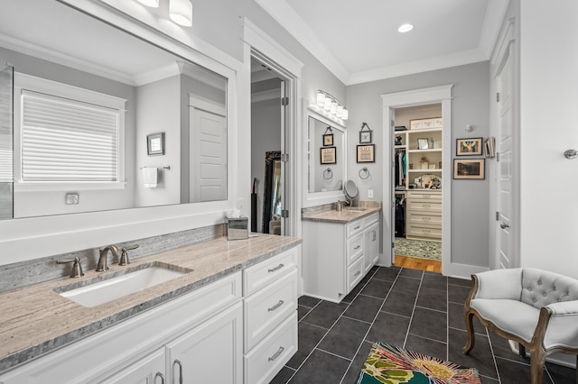 bathroom with vanity, tile patterned floors, and crown molding