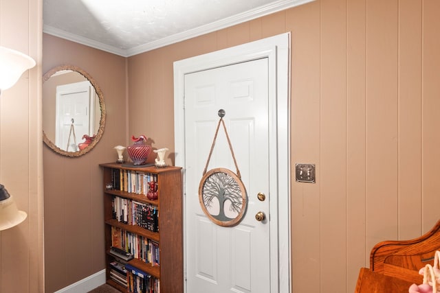 interior space featuring wooden walls and crown molding