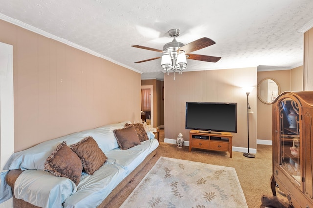 carpeted living room with a textured ceiling, ceiling fan, and ornamental molding