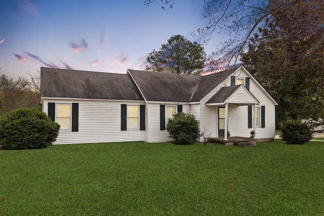 view of front of house with a lawn