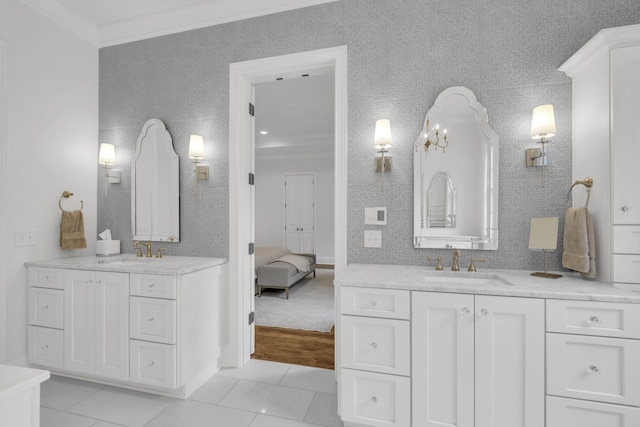 bathroom with vanity, tile patterned floors, crown molding, and a notable chandelier