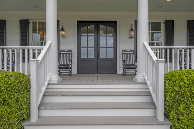 view of exterior entry featuring a porch