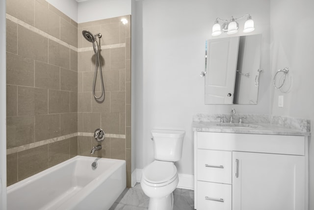 full bathroom featuring toilet, tiled shower / bath combo, and vanity