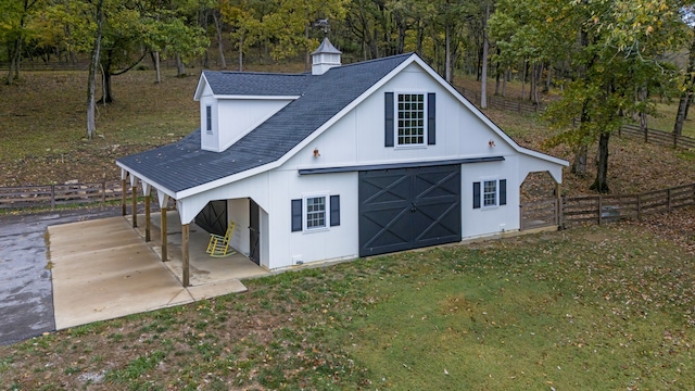 view of outbuilding featuring a lawn