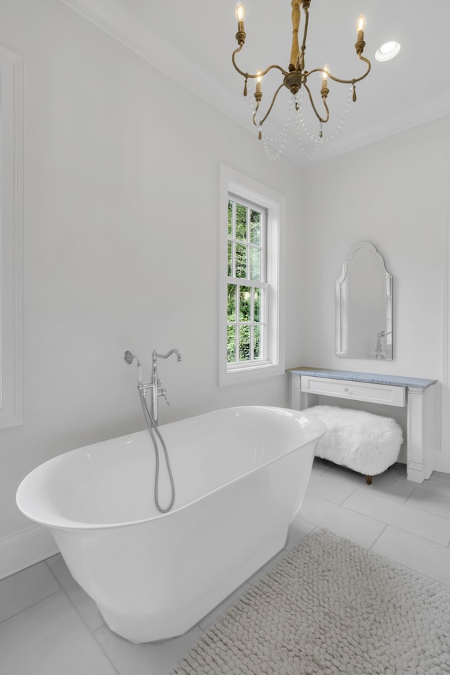 bathroom featuring a tub, a notable chandelier, and crown molding