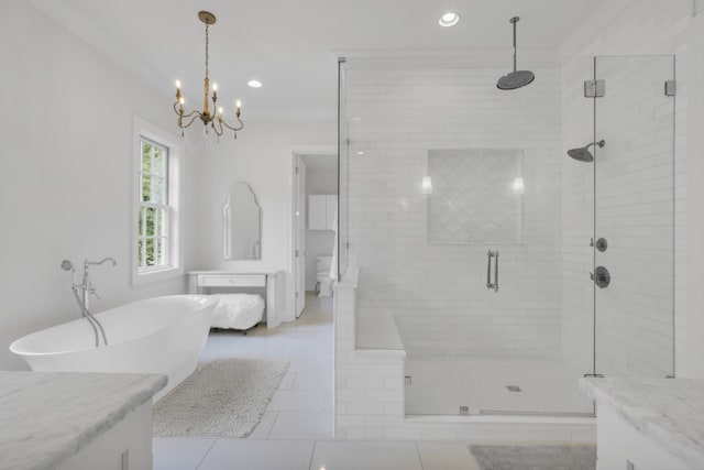 full bathroom featuring an inviting chandelier, independent shower and bath, vanity, crown molding, and tile patterned floors