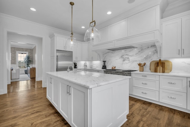 kitchen with white cabinets, dark hardwood / wood-style flooring, decorative light fixtures, and appliances with stainless steel finishes