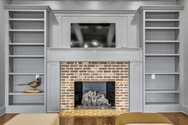 room details with hardwood / wood-style floors and a fireplace