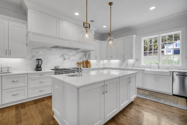 kitchen featuring dishwasher, dark wood-type flooring, decorative light fixtures, and white cabinets