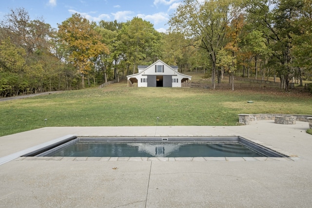 view of pool featuring a patio area and a yard