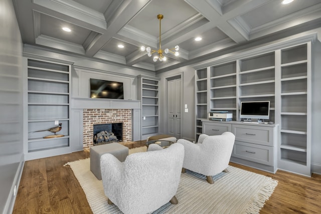 living room featuring built in features, dark hardwood / wood-style flooring, and coffered ceiling