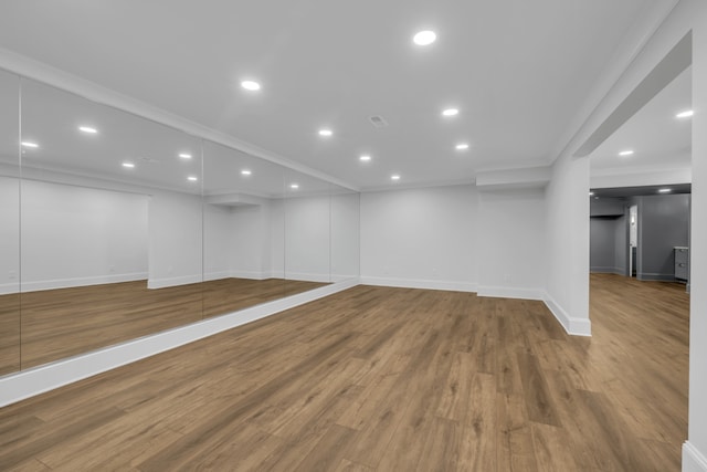 basement with hardwood / wood-style floors