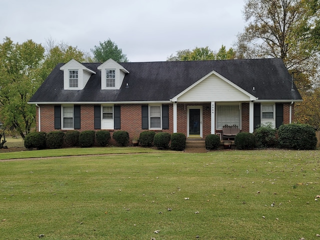 view of front facade featuring a front lawn and covered porch