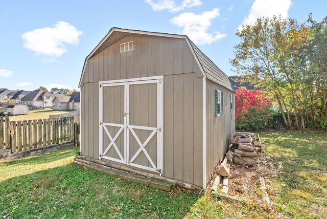 view of outbuilding with a lawn