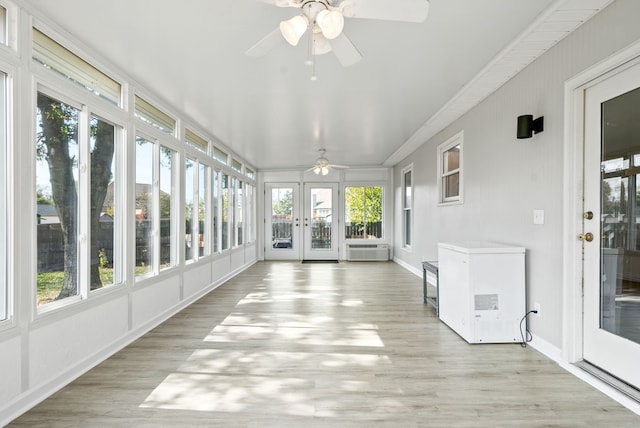 unfurnished sunroom featuring french doors and ceiling fan