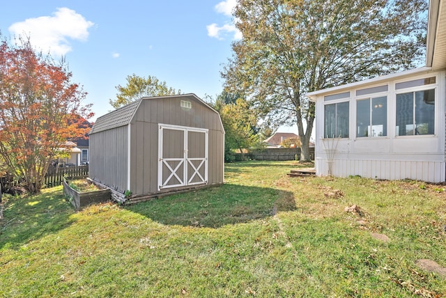 view of outbuilding with a lawn