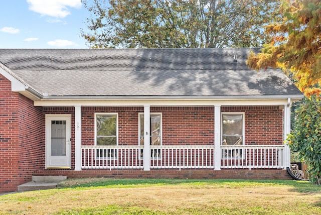 rear view of house with a yard