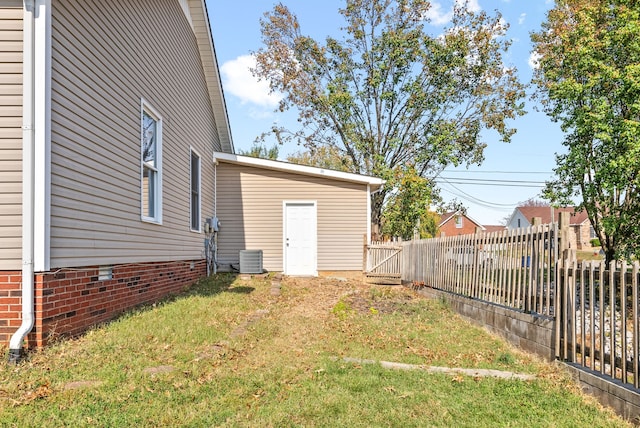 view of yard with central AC unit