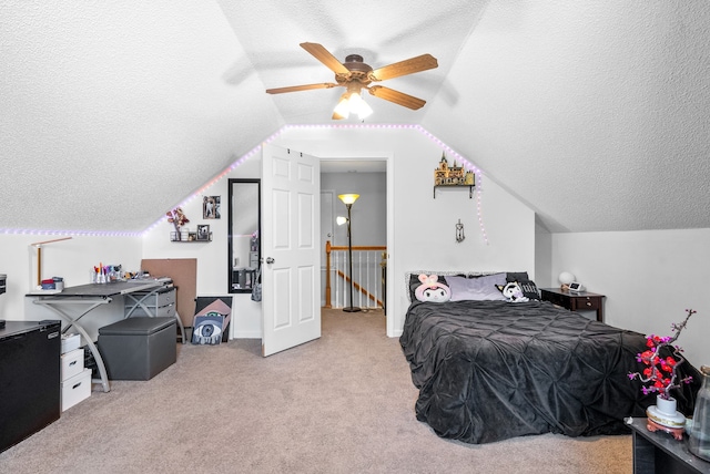 carpeted bedroom featuring ceiling fan, a textured ceiling, and vaulted ceiling