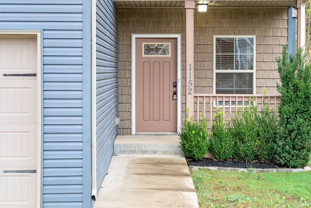 doorway to property featuring covered porch