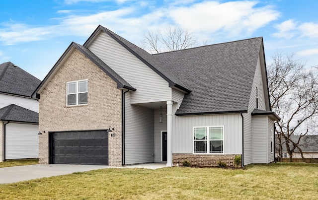 view of front facade with a garage and a front yard