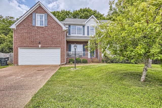 view of front of property featuring a garage, a front lawn, and a porch