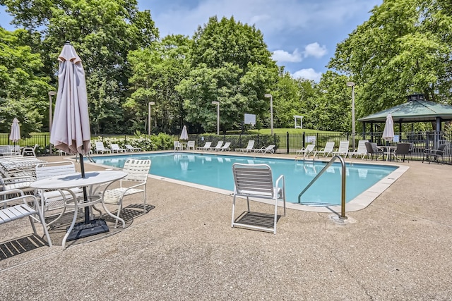 view of swimming pool featuring a gazebo and a patio area