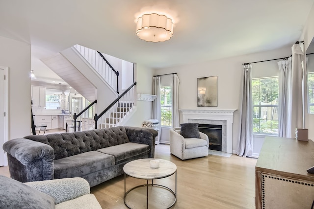 living room featuring plenty of natural light and light wood-type flooring