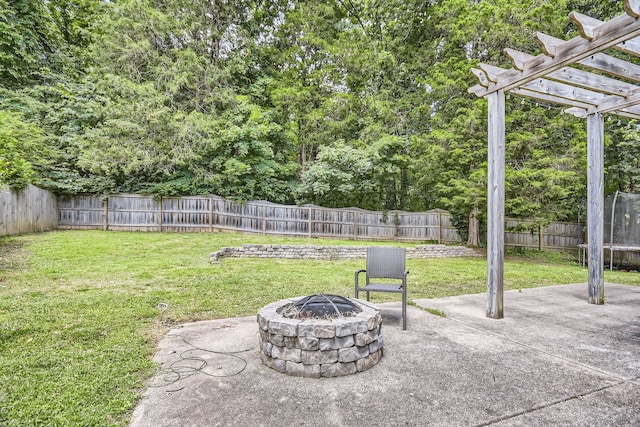 view of patio featuring a pergola and an outdoor fire pit