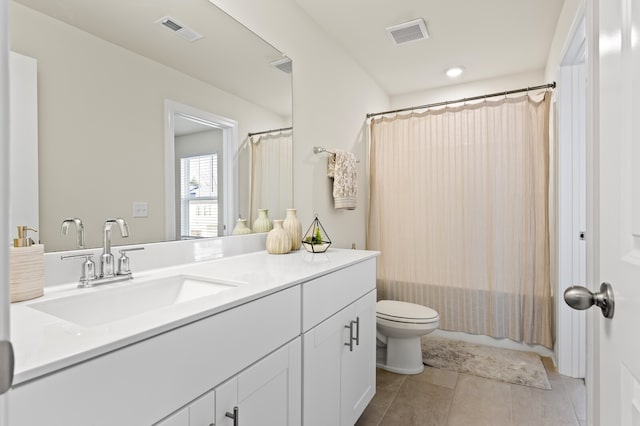 full bathroom featuring vanity, tile patterned floors, toilet, and shower / bath combination with curtain